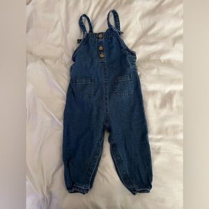 Medium wash Jean baby overalls.